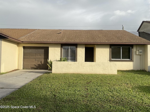 ranch-style house featuring a garage and a front lawn