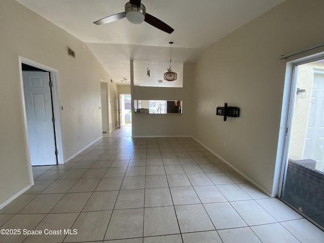 unfurnished living room featuring lofted ceiling, light tile patterned floors, and ceiling fan