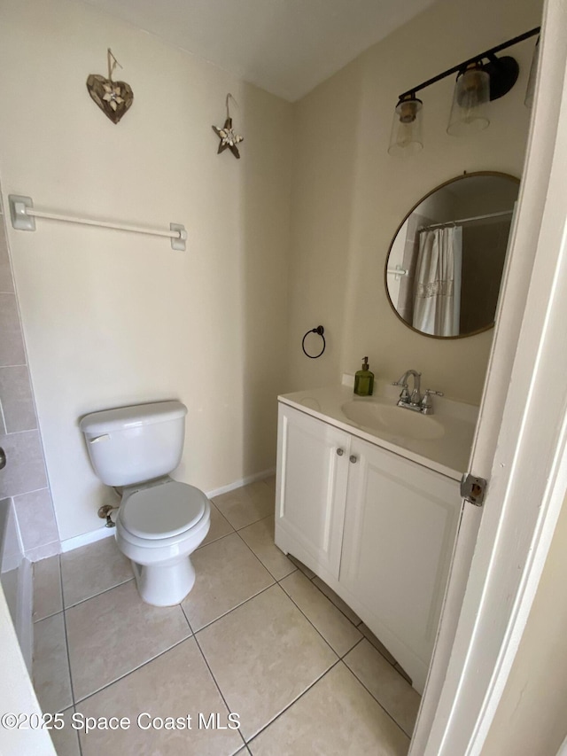 bathroom featuring a shower with curtain, vanity, toilet, and tile patterned flooring