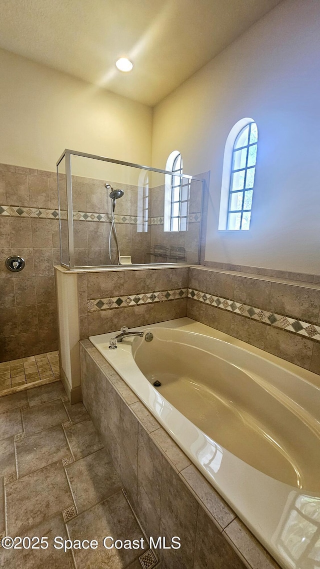 bathroom with independent shower and bath