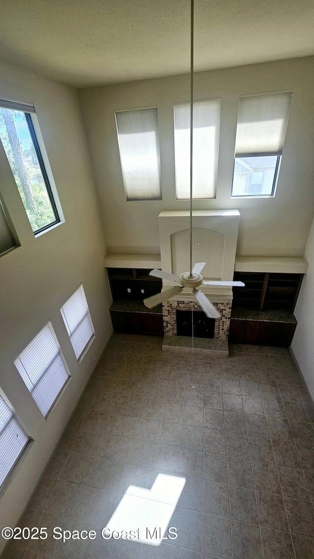 interior space featuring ceiling fan