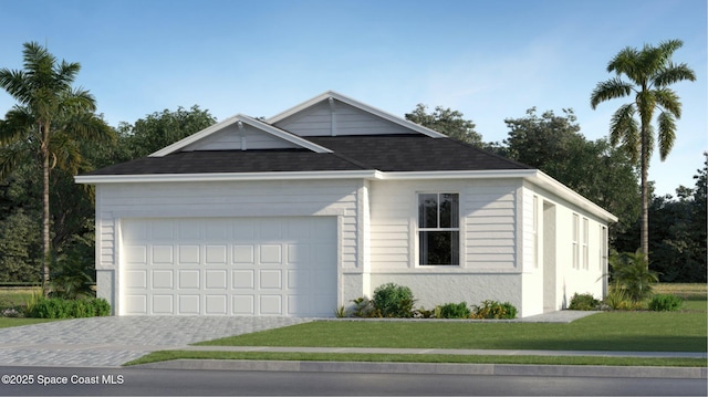 view of front of home with a garage and a front yard