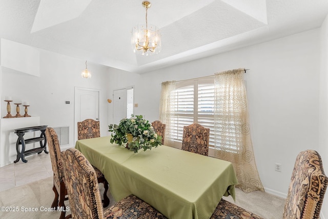 926 Pine Creek Cir NE, Palm Bay, FL 32905 - dining space featuring a chandelier, a raised ceiling, and light carpet