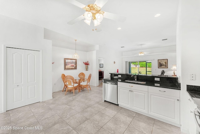 926 Pine Creek Cir NE, Palm Bay, FL 32905 - kitchen featuring dishwasher, a ceiling fan, dark countertops, white cabinetry, and a peninsula