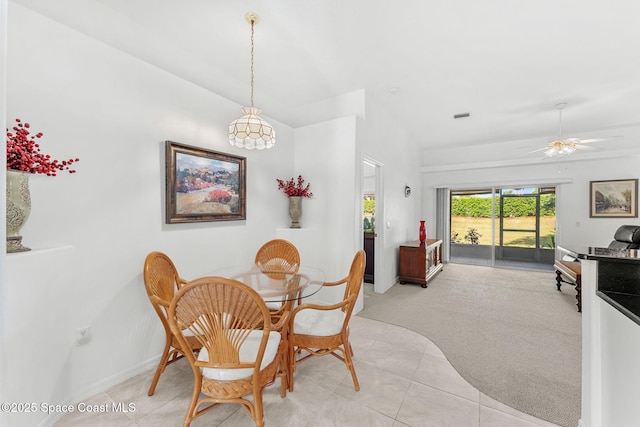 926 Pine Creek Cir NE, Palm Bay, FL 32905 - dining room with light colored carpet, light tile patterned flooring, and a ceiling fan