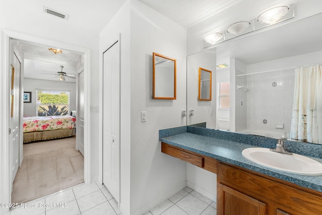 926 Pine Creek Cir NE, Palm Bay, FL 32905 - ensuite bathroom featuring tile patterned flooring, vanity, and ceiling fan