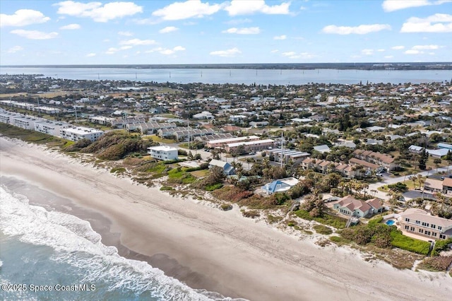 aerial view with a view of the beach and a water view