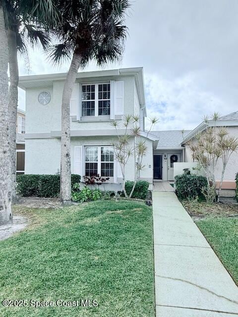 view of front of home featuring a front yard