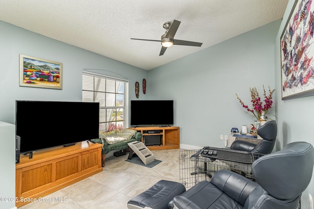 living room with light tile patterned floors, a textured ceiling, vaulted ceiling, and ceiling fan