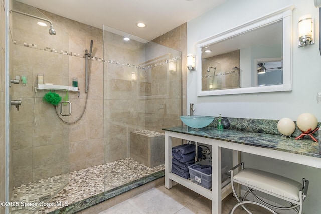 bathroom featuring tile patterned flooring, sink, and walk in shower