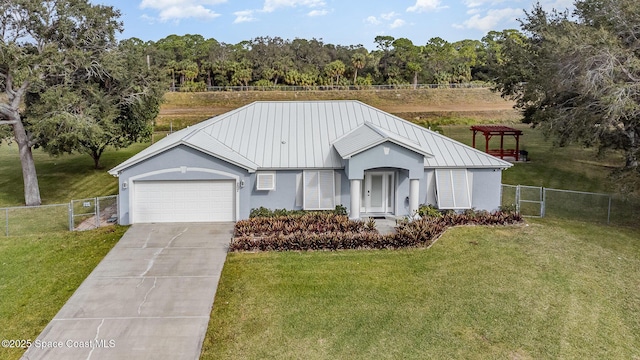 view of front of house with a garage and a front lawn