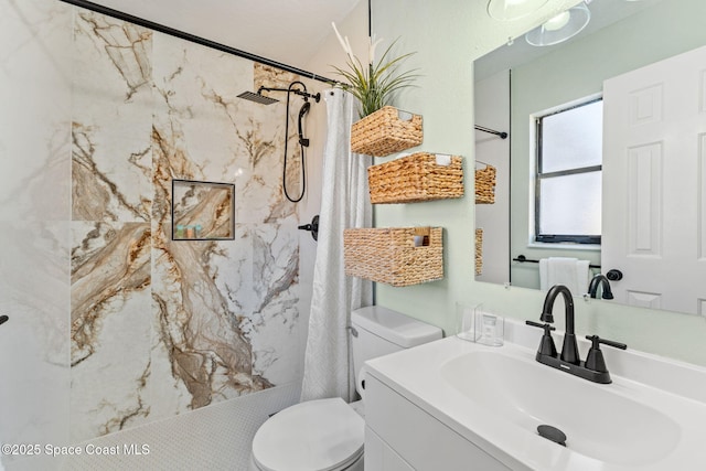 bathroom featuring vanity, toilet, and a shower with shower curtain