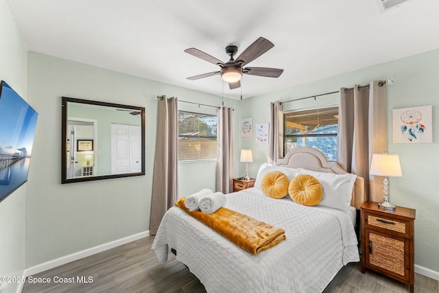 bedroom featuring hardwood / wood-style flooring and ceiling fan