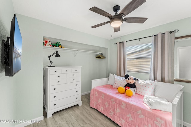 bedroom featuring ceiling fan and light hardwood / wood-style floors