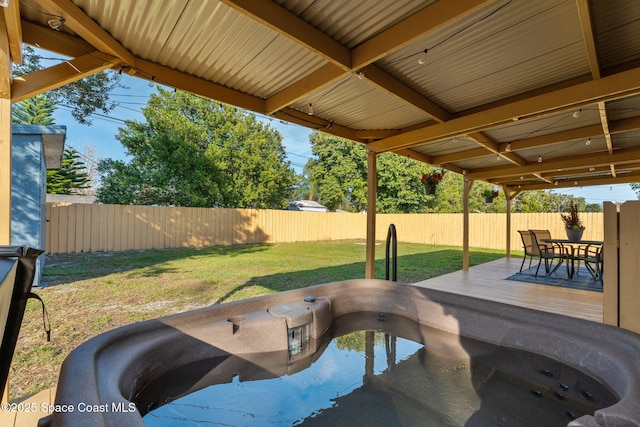 view of pool with a lawn