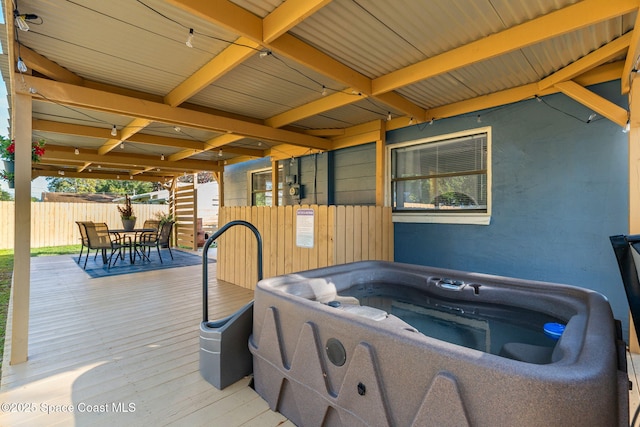 deck with a hot tub