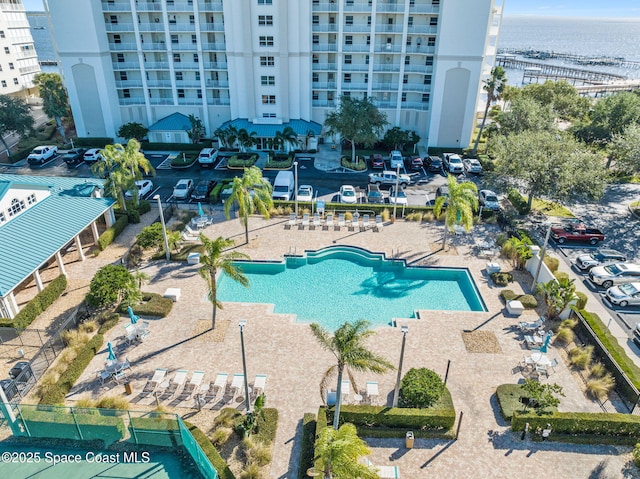 view of pool featuring a water view