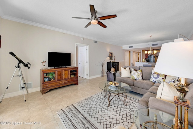 living room with light tile patterned floors, ceiling fan with notable chandelier, and ornamental molding