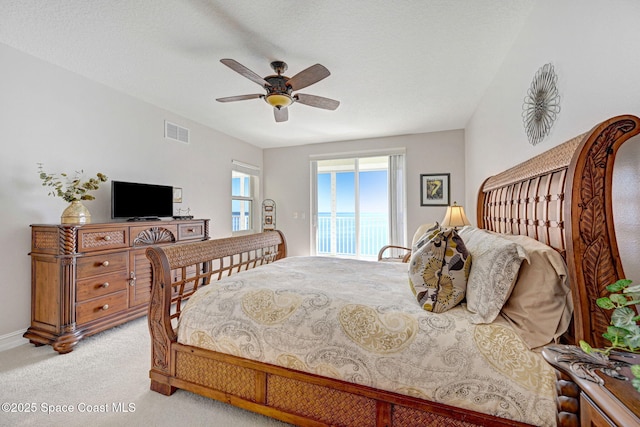 bedroom with light colored carpet and ceiling fan