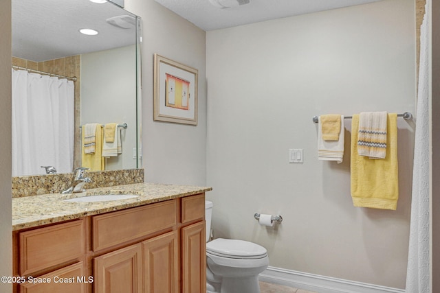 bathroom featuring a shower with curtain, tile patterned floors, vanity, and toilet