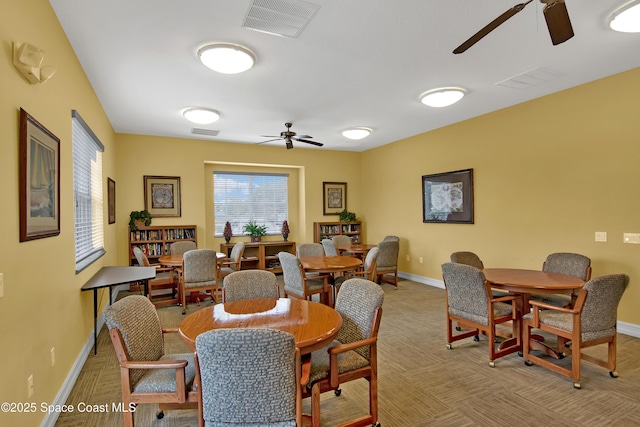 dining space with ceiling fan