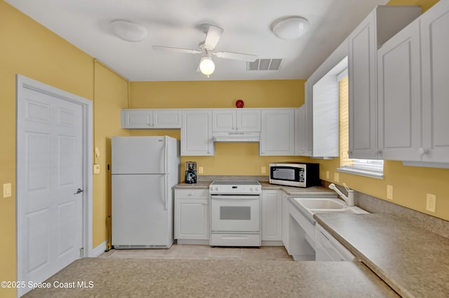 kitchen with white cabinetry, white appliances, and ceiling fan