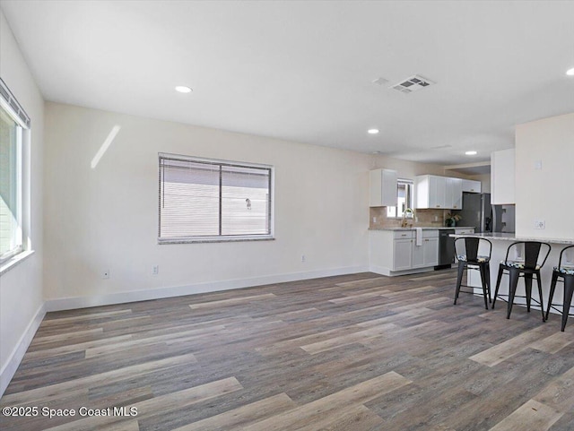 living room with dark wood-type flooring and sink