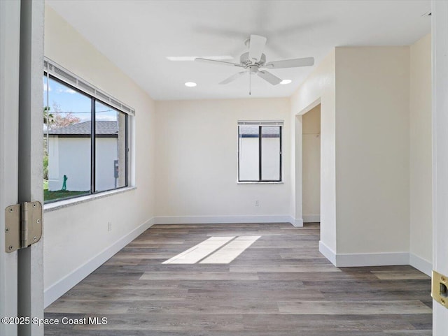 unfurnished room featuring hardwood / wood-style flooring and ceiling fan