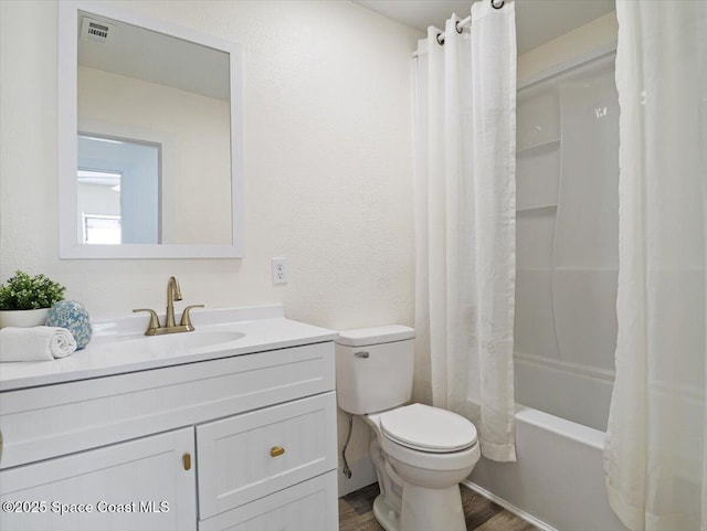 full bathroom featuring shower / bath combination with curtain, vanity, toilet, and hardwood / wood-style floors