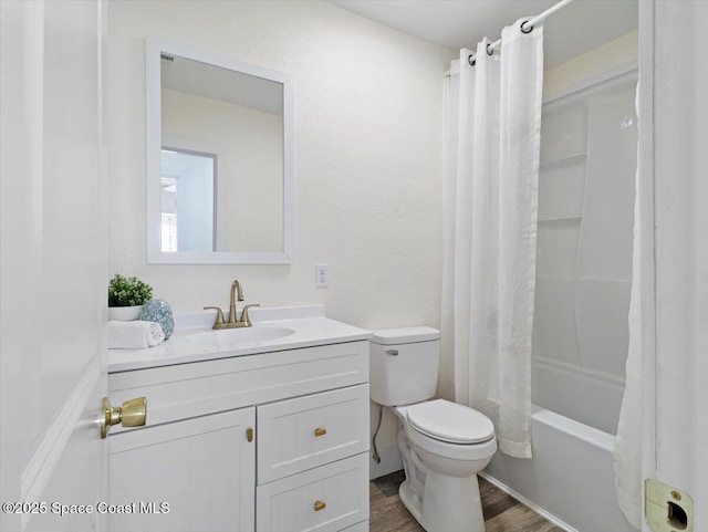 full bathroom with toilet, shower / bath combination with curtain, hardwood / wood-style floors, and vanity