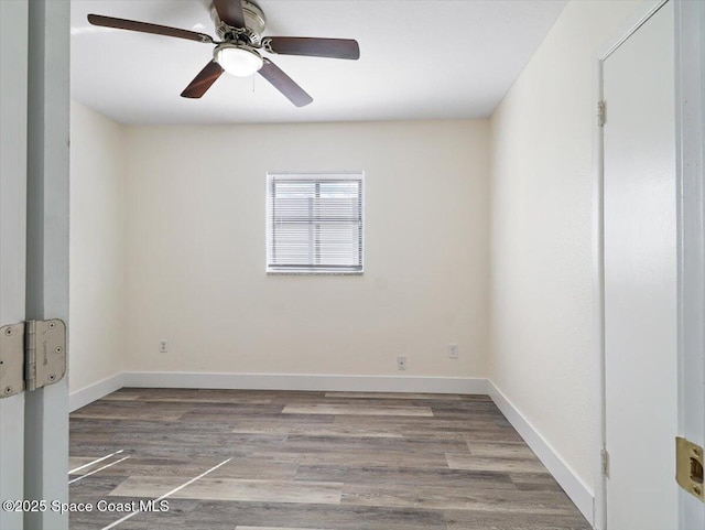 unfurnished room featuring hardwood / wood-style flooring and ceiling fan