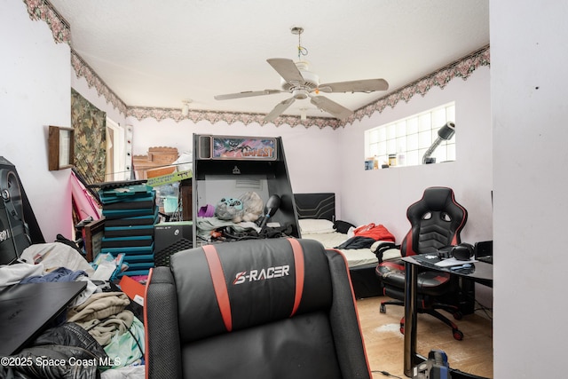 office space featuring hardwood / wood-style flooring and ceiling fan