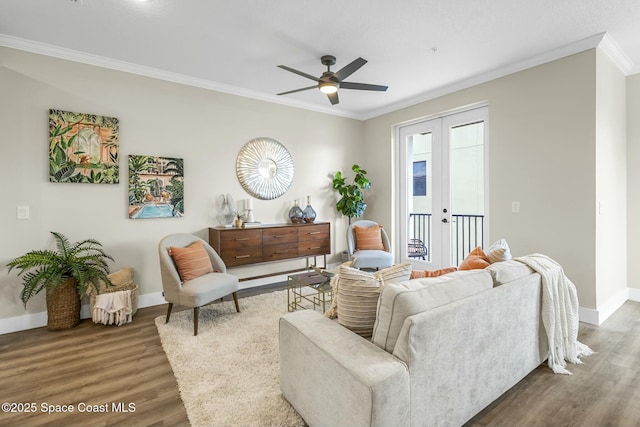 living room with hardwood / wood-style flooring, ornamental molding, ceiling fan, and french doors