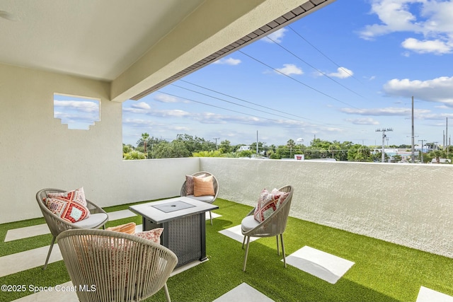 view of patio with a balcony