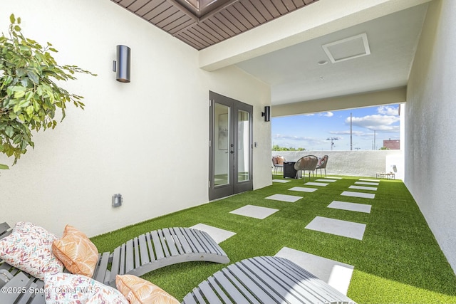 view of yard featuring french doors