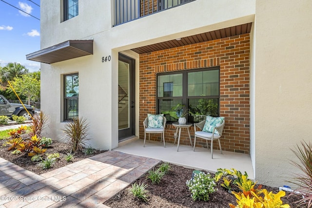 doorway to property with a patio area