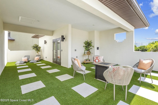 interior space featuring french doors and a fire pit