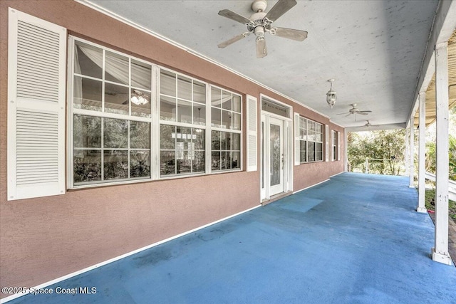 view of patio with ceiling fan