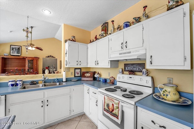 kitchen featuring white cabinets, light tile patterned floors, sink, and electric range