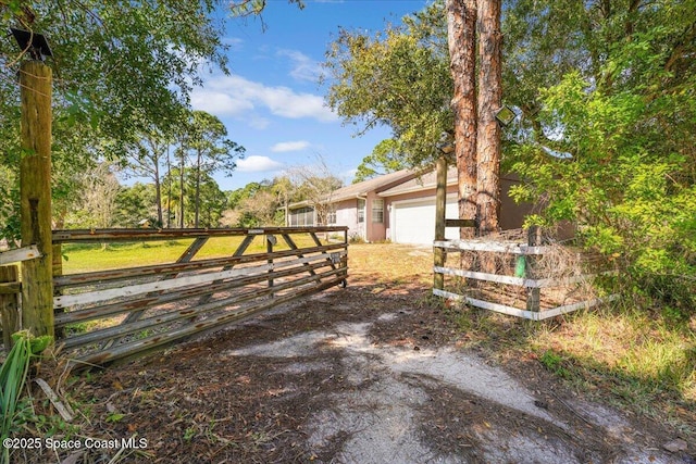 view of yard with a garage