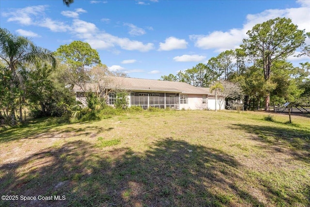 view of yard featuring a sunroom