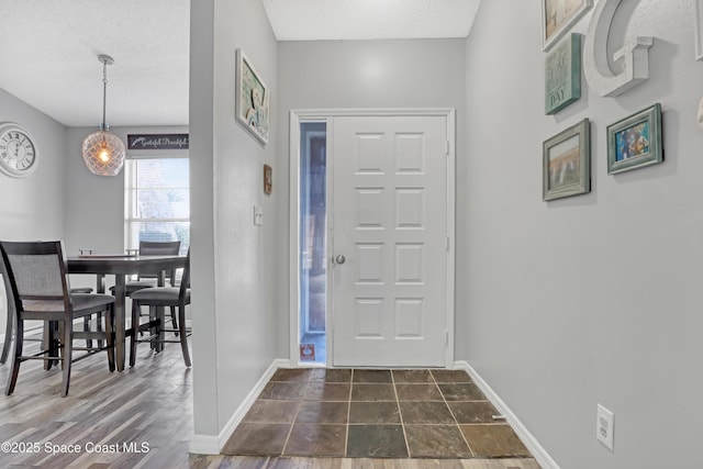 foyer featuring a textured ceiling