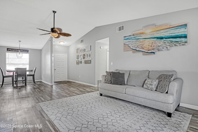 living room featuring hardwood / wood-style flooring, ceiling fan, and lofted ceiling