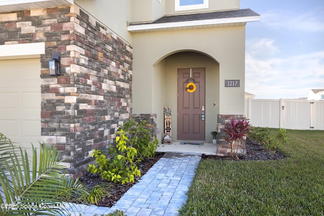 property entrance with a yard