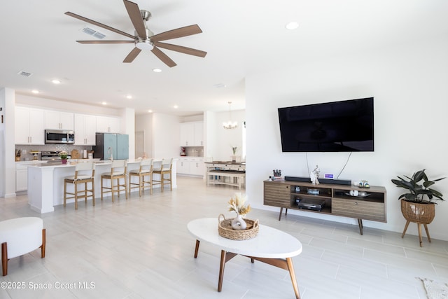 living room featuring ceiling fan