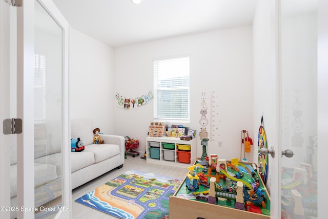 game room featuring hardwood / wood-style floors