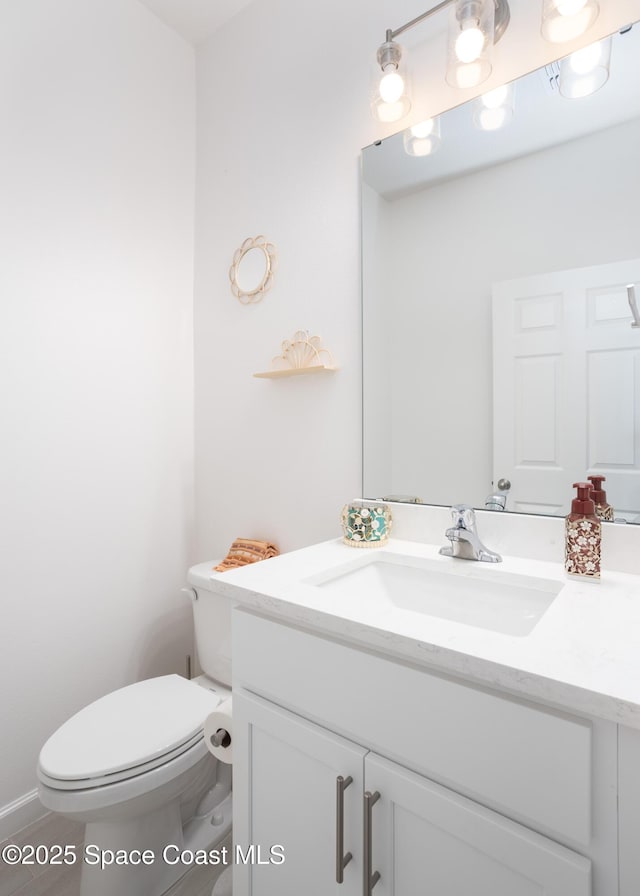 bathroom with vanity and toilet