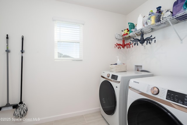 laundry area with washing machine and clothes dryer