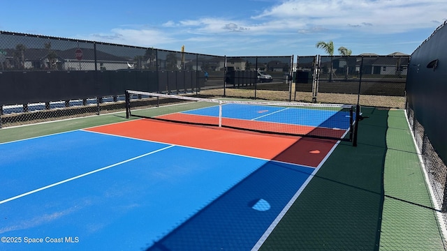 view of sport court featuring tennis court