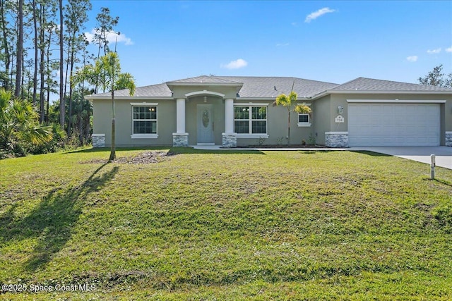 view of front of home with a garage and a front yard